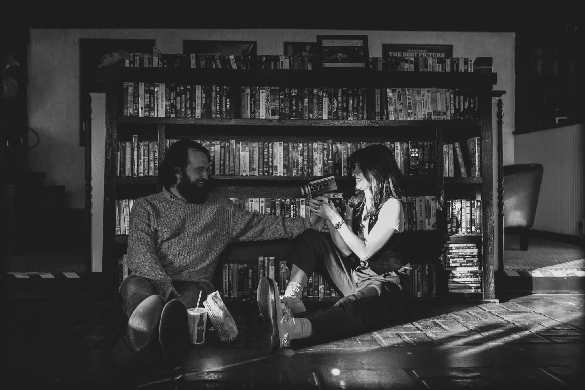Guests browsing the VHS shelf at Royale Cinema Lounge